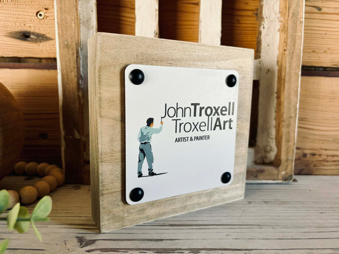Professional desk decor featuring a personalized business logo mini block sign styled on a shelf with office accessories.