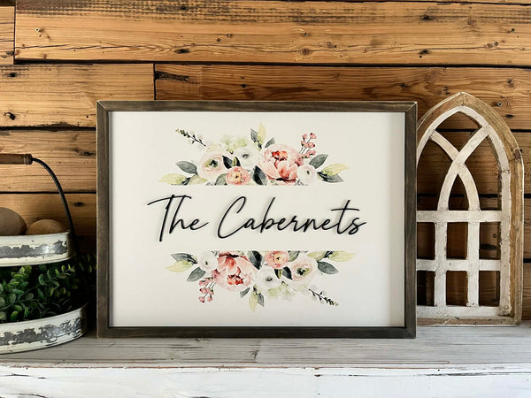 18x24 Custom Family Name Sign with 3D letters and watercolor florals in a Jacobean wood frame.