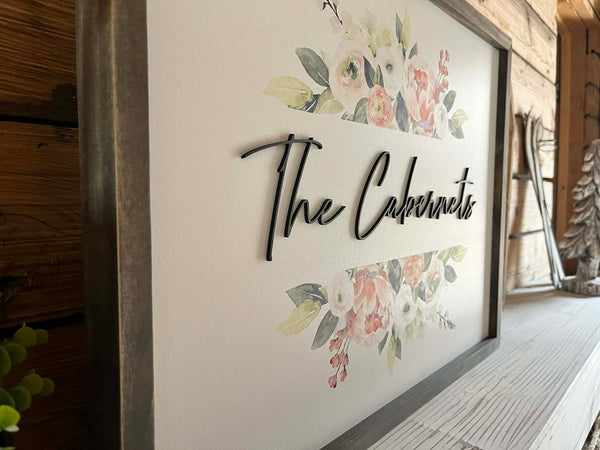 18x24 Custom Family Name Sign with 3D letters and watercolor florals in a Jacobean wood frame.