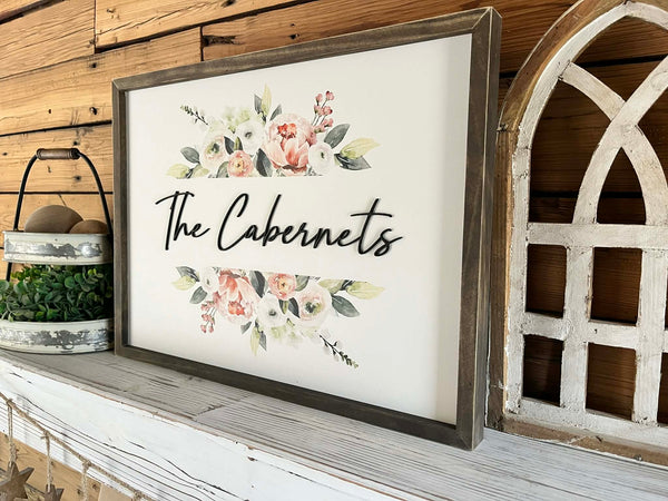 18x24 Custom Family Name Sign with 3D letters and watercolor florals in a Jacobean wood frame.