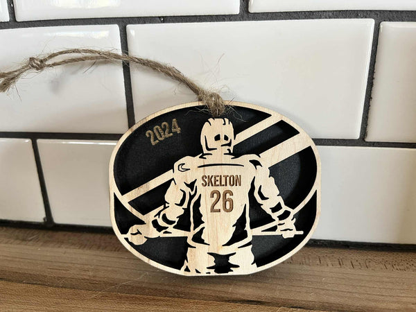 3-inch round maple and MDF hockey ornament personalized with player name and number