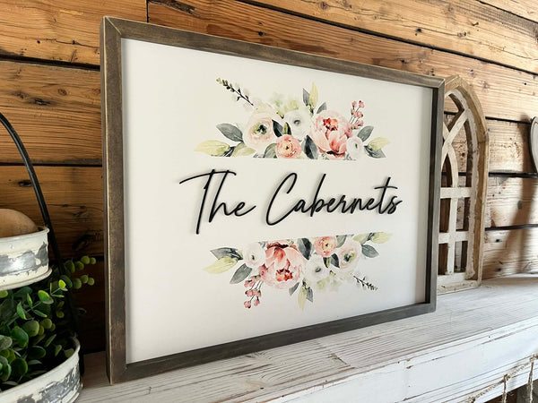 18x24 Custom Family Name Sign with 3D letters and watercolor florals in a Jacobean wood frame.