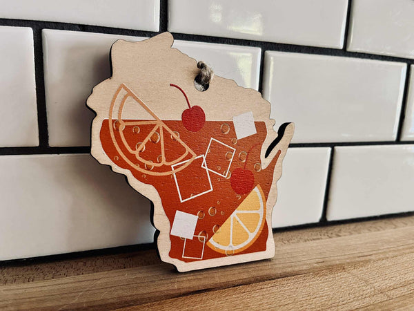 Maple wood Wisconsin ornament with cherry and orange garnish design