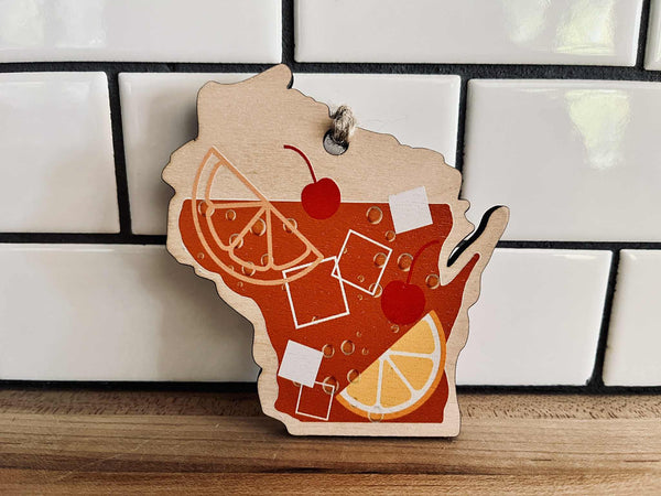Wisconsin state-shaped ornament with old fashioned cocktail design