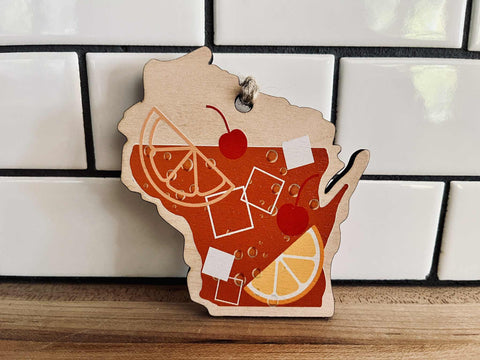 Wisconsin state-shaped ornament with old fashioned cocktail design