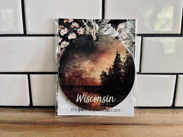 Wisconsin sunset maple wood ornament with forest silhouette and jute cord