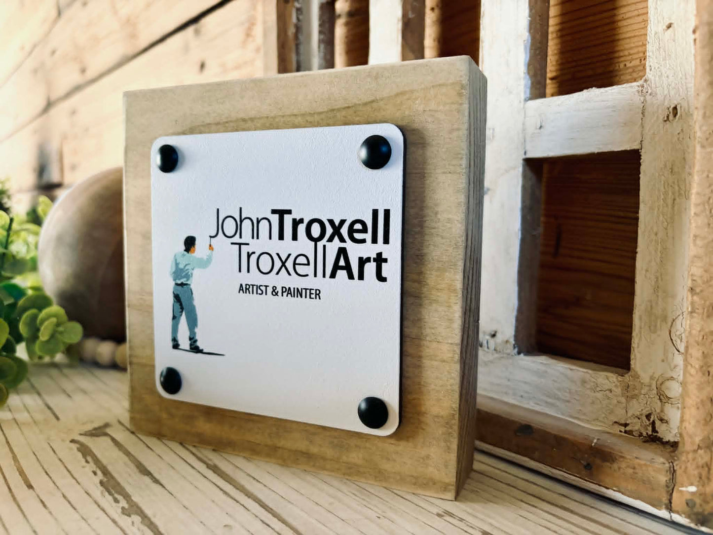 Side view of a free-standing 2x6 wood block sign showing the dimensional 1/4 inch maple top and decorative tack detailing.