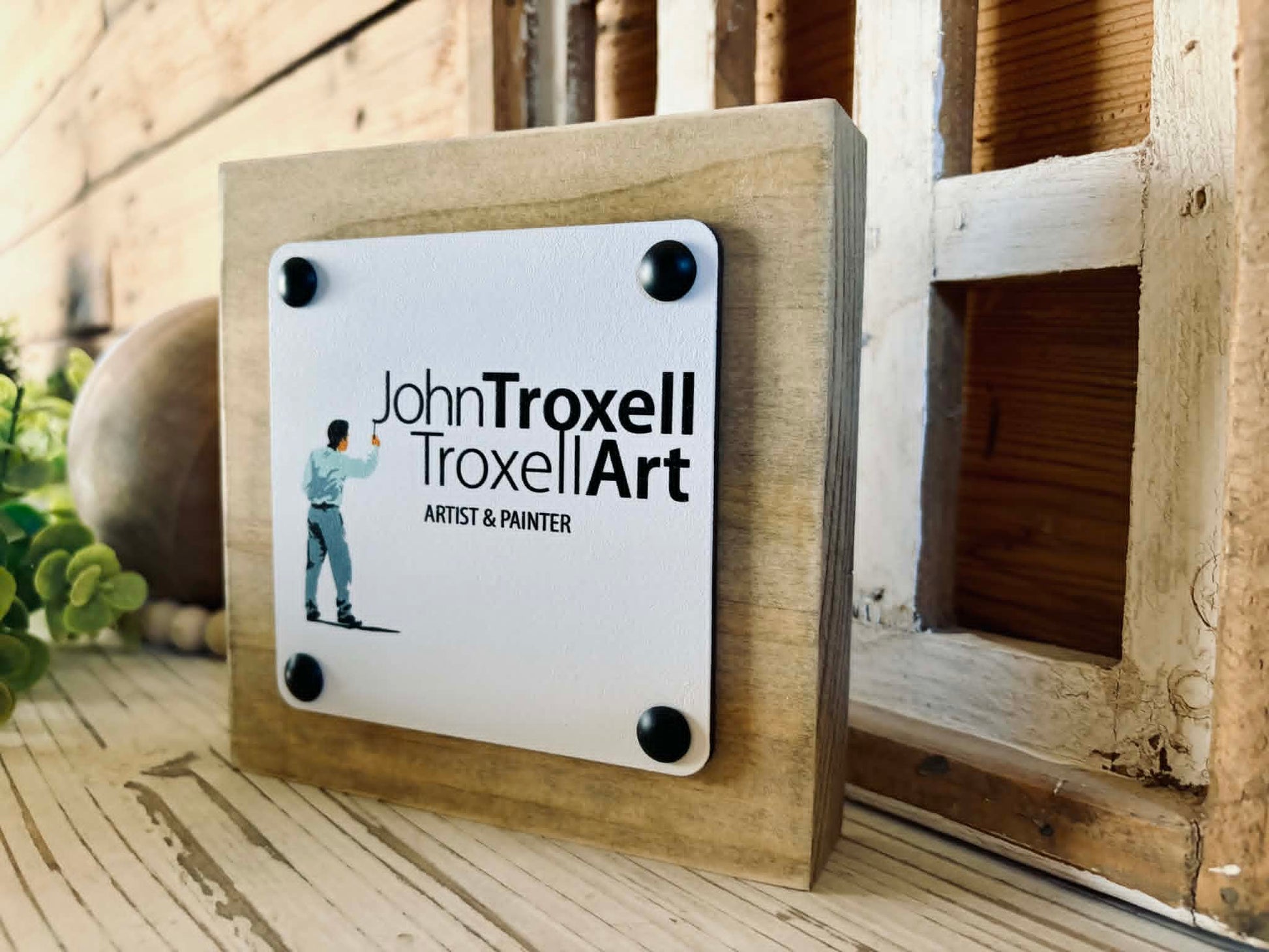 Side view of a free-standing 2x6 wood block sign showing the dimensional 1/4 inch maple top and decorative tack detailing.