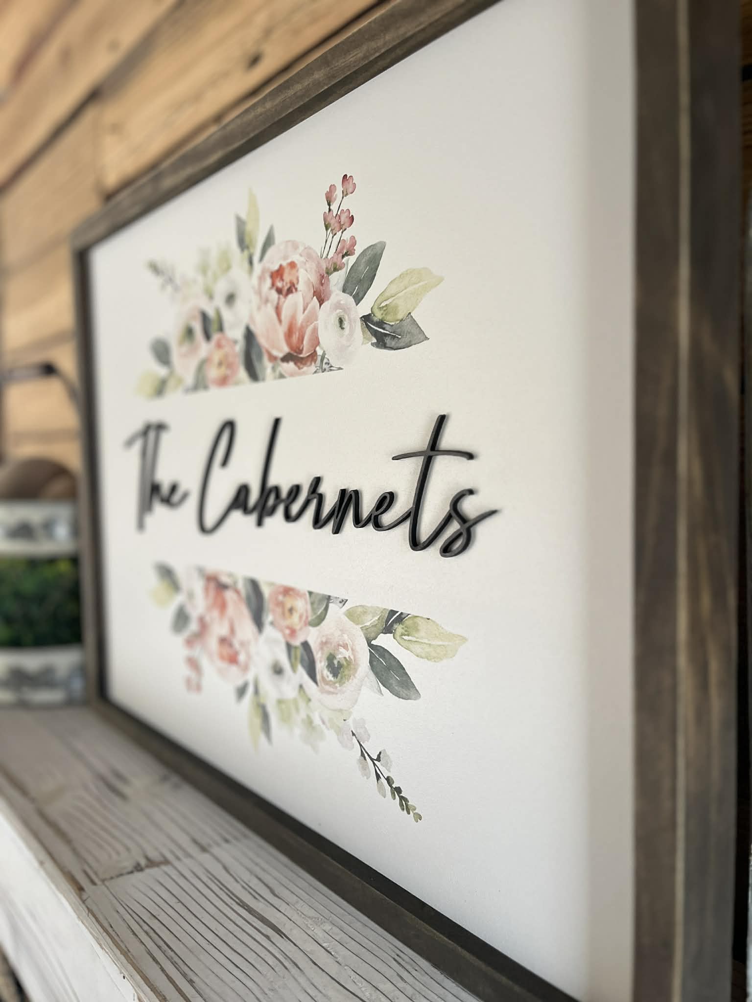 18x24 Custom Family Name Sign with 3D letters and watercolor florals in a Jacobean wood frame.