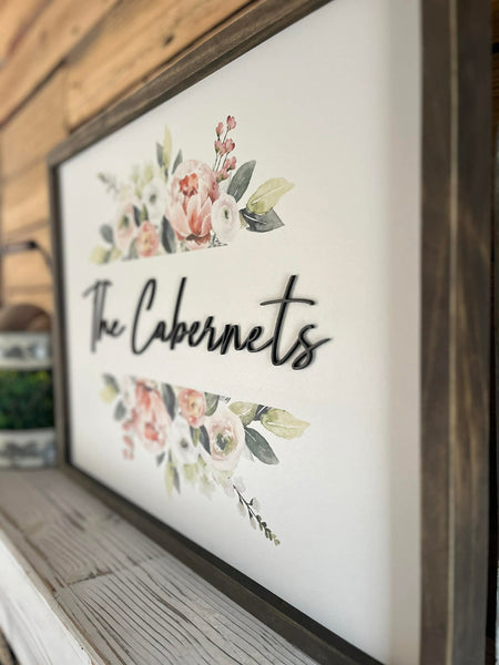 18x24 Custom Family Name Sign with 3D letters and watercolor florals in a Jacobean wood frame.
