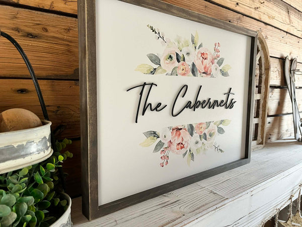 18x24 Custom Family Name Sign with 3D letters and watercolor florals in a Jacobean wood frame.
