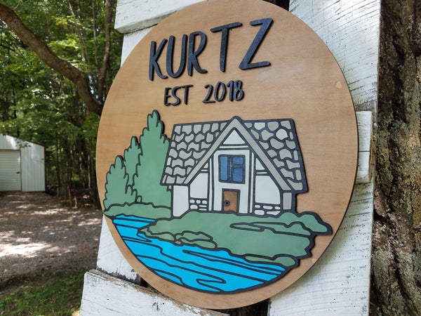 Round Personalized Name and Established Date Sign with Raised Lettering and Cabin Scene