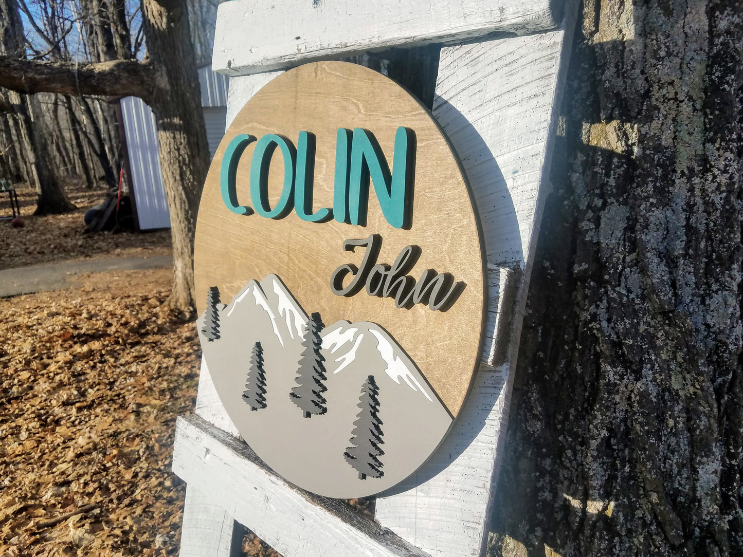 Round Personalized Nursery Name Sign with Raised Lettering and Mountain Scene