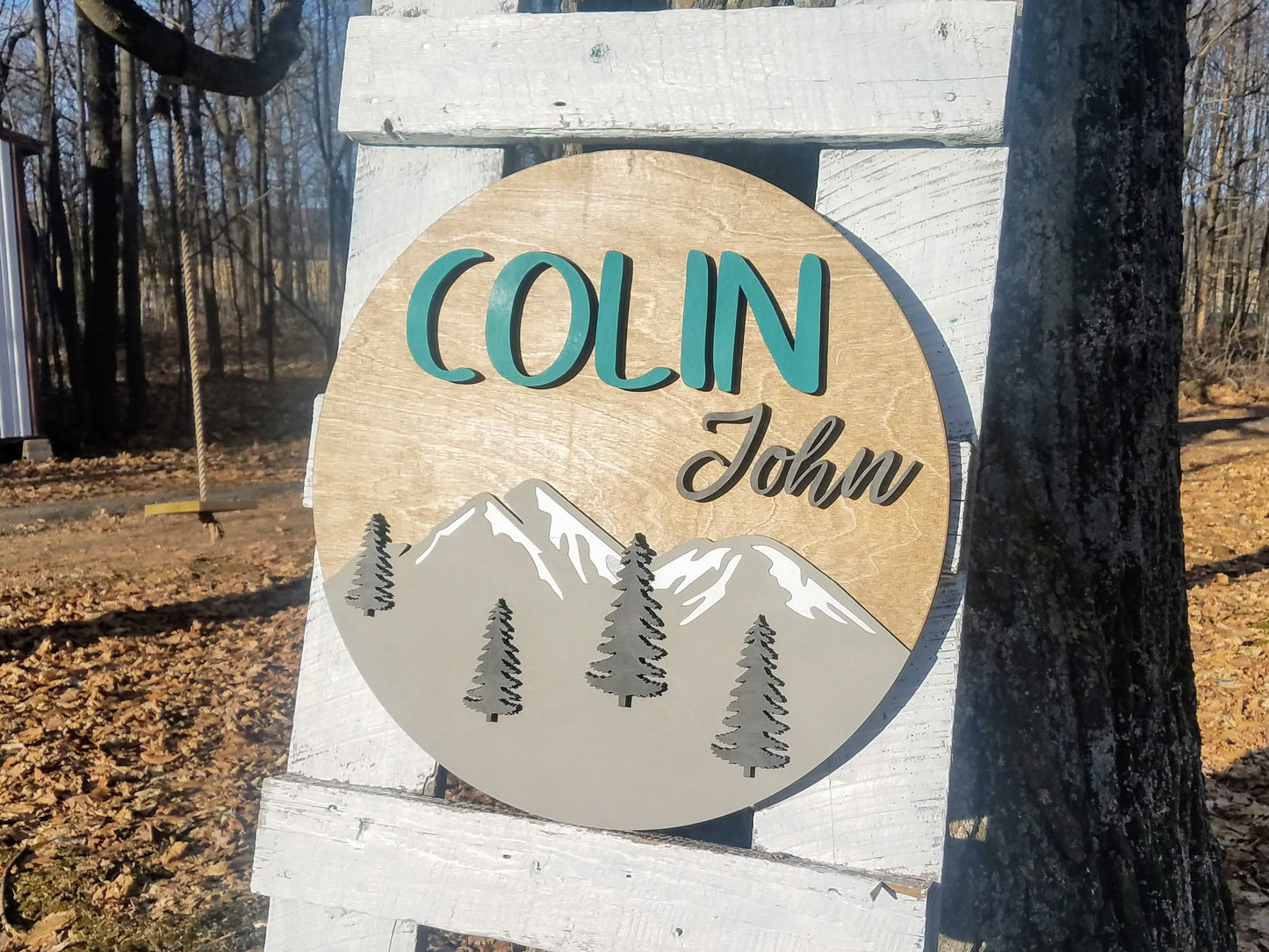 Round Personalized Nursery Name Sign with Raised Lettering and Mountain Scene