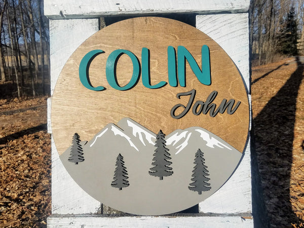 Round Personalized Nursery Name Sign with Raised Lettering and Mountain Scene